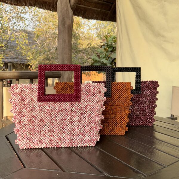 Zeyna [orange with brown handle]