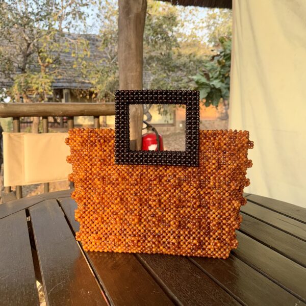 Zeyna [orange with brown handle]