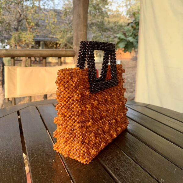 Zeyna [orange with brown handle]