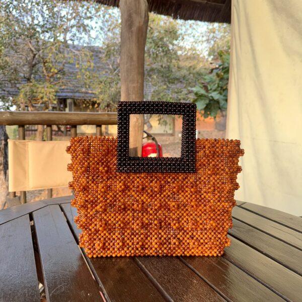 Zeyna [orange with brown handle]